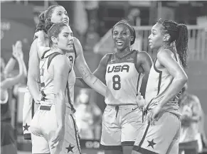  ?? ANDREW NELLES/ USA TODAY SPORTS ?? Jackie Young ( 8) celebrates with her 3- on- 3 teammates after they won gold.