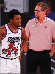  ?? (AP/Kevin C. Cox) ?? Toronto Raptors guard Kyle Lowry (left) leads the NBA in charges drawn for the second time in three years. It’s something that makes Coach Nick Nurse (right) cringe a little. “He knows how to do it just right. He usually bounces up,” Nurse said.