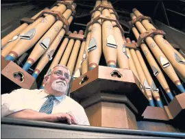  ?? PHOTOS BY KARL MONDON — STAFF PHOTOGRAPH­ER ?? Michael Joyce, organist at Trinity Episcopal Cathedral in San Jose, sits Thursday with the 1884Hook and Hastings rank organ that was installed nearly a century ago.