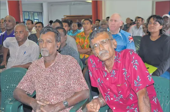  ?? Picture: REINAL CHAND ?? Sugarcane farmers Vijay Kumar, left, and Parmendra Singh attend a sugar consultati­on at the Sugar Cane Growers Council Hall in Lautoka.