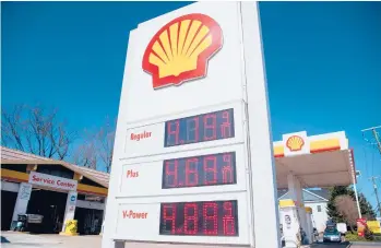  ?? SAUL LOEB/GETTY-AFP ?? Fuel prices are displayed at a gas station on March 16 in Arlington, Virginia.