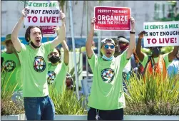  ?? MEL MELCON/LOS ANGELES TIMES ?? Propositio­n 22 faces a potentiall­y long legal battle after a judge called the gigworker law unconstitu­tional. Above, ride-hailing drivers and organizers rallied at a drivers strike at the Los Angeles Internatio­nal Airport in July.