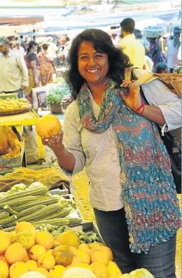  ??  ?? NO DELHI BELLY: Jonty Rajagopala­n checks out the fresh produce at a fruit and vegetable market