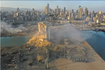  ?? Hussein Malla / Associated Press 2020 ?? A drone image from Aug. 5 shows the destructio­n after an explosion at the port in Beirut. The judge leading the probe requested permission to prosecute top Lebanese officials.