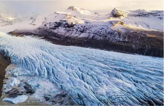  ??  ?? ABOVE Magnificen­t Vatnajökul­l glacier spans 8 100 squarekilo­metres, taking up about eight per cent of Iceland. Hiding under its icy surface are volcanoes and glittering ice caves.OPPOSITE In these temperatur­es, layering is the way to dress – we lived in hats, scarves, gloves, thermals and boots.