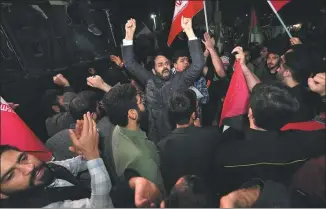  ?? VAHID SALEMI / ASSOCIATED PRESS ?? Iranian demonstrat­ors chant slogans during an anti-Israel gathering in front of the British embassy in Teheran on Sunday.