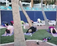  ?? THE ASSOCIATED PRESS ?? The Green Valley Ranch hotel hosts daily yoga classes beside its pool.