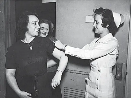  ??  ?? This file photo taken in January 1943 shows US Office of War Informatio­n employees receiving free inoculatio­ns against smallpox, as well as diptheria and typhoid, in Washington, DC, the United States. — All photos/AFP