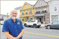  ?? CARLA ALLEN ?? Yarmouth businessma­n Richard LeBlanc stands in front of two buildings he dramatical­ly transforme­d on Main Street.