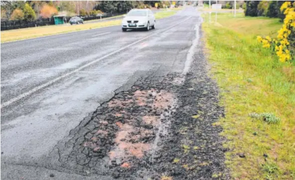  ??  ?? SAFETY FIX: Poor road conditions, such as this pothole on the Bellarine Highway, could be the cause of a fatal accident.