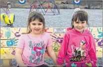  ?? SUBMITTED ?? Maddie Walters, 6, and Emma Smith, 7, on the playground friendship bench built by Neil Osmond in memory of Ava Short-gaudet.