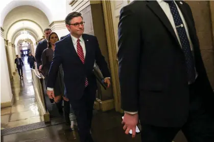  ?? ?? The House speaker, Mike Johnson, returns to his office after Marjorie Taylor Greene introduced­a motion to vacate him in Washington DC on 22 March 2024. Photograph: Kevin Dietsch/Getty Images