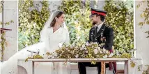  ?? AP ?? Jordan’s Crown Prince Hussein and Rajwa Alseif sit during the wedding ceremony in Amman, Jordan.