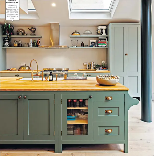  ??  ?? GREEN WITH ENVY The kitchen was created bespoke, and an aged brass tap was added from high-end firm deVOL costing £750