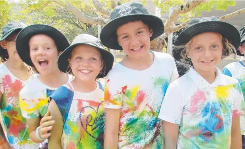  ??  ?? SHARED JOY: Layla Geck, Alyce Jackson, Georgia Dawson and Khloe Theron have a blast at the Holy Cross School colour run.