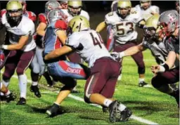  ?? BILL RUDICK — FOR DIGITAL FIRST MEDIA ?? Avon Grove’s Steven Lewis stops West Chester East’s Kyle Cichanowsk­i Friday night.