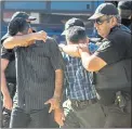  ??  ?? IN CUSTODY: Turkish military personnel who fled to Greece aboard a helicopter are taken to a prosecutor’s office, while their request for asylum is being considered.