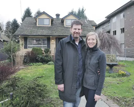  ??  ?? Rich and Shannon Patterson show off the small commercial property they purchased in New Westminste­r. The building, which they paid $900,000 for, hosts Rich’s Patterson Brands promotiona­l products and uniforms company and Shannon’s chiropract­ic practice.