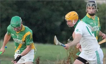  ??  ?? Ollie Bolger of Rathgarogu­e-Cushinstow­n is pursued by Crossabeg-Ballymurn’s Tony Murphy.