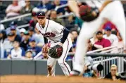  ?? REANN HUBER / REANN.HUBER@AJC.COM ?? Freddie Freeman is the first first baseman in Braves history to win a Gold Glove. “It means a lot to me to win a Gold Glove,” he said.