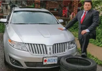  ?? COURTESY OF FRANK D’AMICO ?? Toronto Catholic District School Board trustee Frank D’Amico poses with his sedan, a repeat target for vandals.