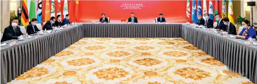  ?? ?? On March 29, the Internatio­nal Department of the CPC Central Committee holds a seminar via video link on inter-party interactio­ns