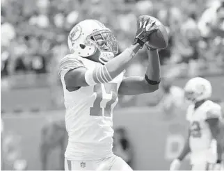  ?? WILFREDO LEE/AP ?? Dolphins wide receiver Allen Hurns catches a pass before the game against the Patriots on Sept. 15.