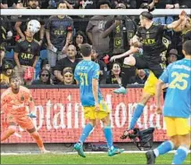  ?? Wally Skalij Los Angeles Times ?? GARETH BALE, in air, knocks a header past Union goalkeeper Andre Blake, left, to tie the score late in extra time for LAFC.