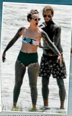  ??  ?? Sun queen queen: Keira Knightley by the lake and nd having mud rubbed on her back by husband James