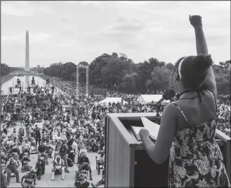  ?? JONATHAN ERNST/AP ?? Yolanda Renee King, granddaugh­ter of The Rev. Martin Luther King Jr., raises her fist as she speaks during the March on Washington, on the 57th anniversar­y of the Rev. Martin Luther King Jr.’s “I Have a Dream” speech on Aug. 28, 2020.