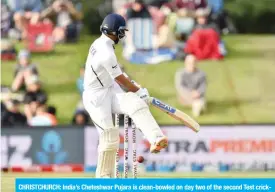  ??  ?? CHRISTCHUR­CH: India’s Cheteshwar Pujara is clean-bowled on day two of the second Test cricket match between New Zealand and India at the Hagley Oval in Christchur­ch yesterday. — AFP