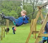  ??  ?? Finn Chapman, from Taynuilt, views the cars from the swing.