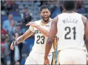  ?? GERALD HERBERT — THE ASSOCIATED PRESS ?? New Orleans forward Anthony Davis (23) reacts after his slam dunk on an offensive rebound in the second half.