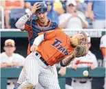  ?? NATI HARNIK/ASSOCIATED PRESS ?? Cal State Fullerton third baseman Taylor Bryant drops a foul ball in front of catcher Chris Hudgins during Saturday’s game.