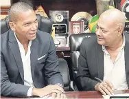  ?? CONTRIBUTE­D ?? Jamaica Football Federation (JFF) President Michael Ricketts (right) chats with Co-CEO of ReadyTV Chris Dehring after signing a memorandum of understand­ing, which will see the developmen­t of a new JFF TV station – JFF LIVE.