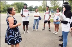  ?? Arnold Gold / Hearst Connecticu­t Media file photo ?? New Haven Director of Public Health Maritza Bond, left, speaks with Public Health College Corps members in the Bowen Field parking lot in New Haven on July 29.