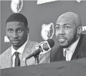  ??  ?? New Memphis Grizzlies players Jaren Jackson Jr. (left) and Jevon Carter field questions from the media during a press conference Friday at FedExForum. BRANDON DILL/FOR THE COMMERCIAL APPEAL