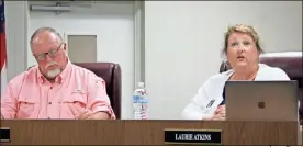  ?? Jeremy Stewart ?? Polk County Schools Superinten­dent Laurie Atkins (right) discusses the system’s plan for welcoming students back to school on Aug. 3 alongside school board Chair J.P. Foster during the board’s work session on Tuesday, July 7.