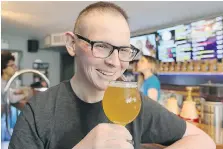  ?? NICK BRANCACCIO ?? Walkervill­e Brewery brewer Jeffrey Craig samples a glass of the dandelion beer Fine N’ Dandy he helped create with the Craft Heads Brewing Company last April. Craig died Monday at the age of 25.