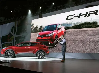  ?? Bloomberg News/TROY HARVEY ?? Bill Fay, group vice president and general manager at Toyota Motor Corp., speaks during the unveiling of the Toyota C-HR coupe at the Los Angeles Auto Show in November. Fay said Thursday that 2016 auto sales will come close to matching 2015’s record...