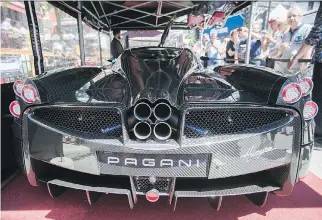  ?? -PIERRE OBENDRAUF/FILES ?? This 2016 Pagani Huayra, on display on de Maisonneuv­e Blvd. W. just west of Crescent St., has a 6-litre, 12-cylinder, twin-turbo engine that can reach a top speed of 370 km/h.