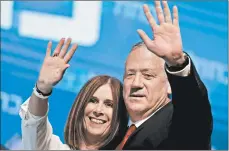  ?? EMMANUEL DUNAND/GETTY-AFP ?? Benny Gantz and his wife, Revital, greet Blue and White backers after initial election results Wednesday in Tel Aviv.