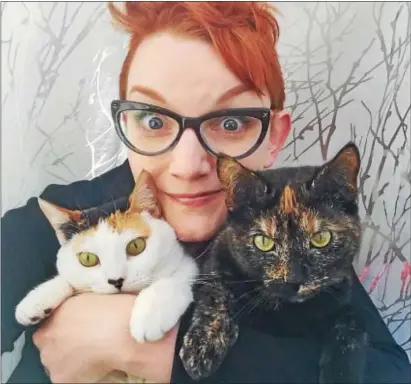  ?? PHOTO COURTESY LAURA KICEY ?? Laura Kicey with her “mid-level celebrity” cats, Olive and Rye.