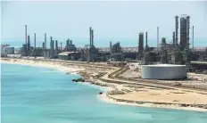  ?? Reuters ?? Aramco’s Ras Tanura oil refinery and oil terminal in Saudi Arabia. The kingdom pushing into petrochemi­cals as a way to earn more from its energy deposits.