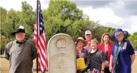  ?? Submitted photo ?? ■ The Dedication Team included, from left, Dale Lovell in period costume, Pat Mclemore, Charles Mclemore, of Mount Ida, Jerrie Townsend, of Pine Bluff, and Bobbie Lovell and Sheila Beatty, of Hot Springs Village, at the grave of Solomon Spence Sr. The Lovells, of Bismarck, provided a replica of the 15-Star Flag that flew over Fort Mchenry during the War of 1812 and often called the Star-spangled Banner.