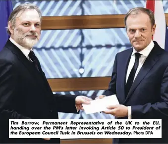  ?? Photo DPA ?? Tim Barrow, Permanent Representa­tive of the UK to the EU, handing over the PM's letter invoking Article 50 to President of the European Council Tusk in Brussels on Wednesday.