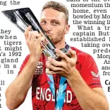  ?? AFP ?? Captain marvellous: Buttler celebrates with the T20 World
Cup trophy