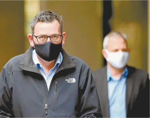  ?? Darrian Traynor / Getty Images ?? Victorian Premier Daniel Andrews and the state’s chief health officer, Brett Sutton.