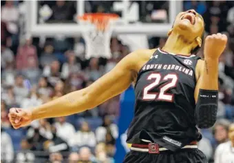  ?? THE ASSOCIATED PRESS ?? South Carolina forward A’ja Wilson celebrates after the Gamecocks beat Mississipp­i State to win the SEC tournament Sunday in Nashville. Wilson scored 16 points to lead South Carolina.