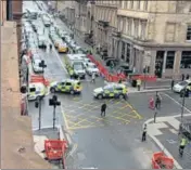  ?? REUTERS ?? Emergency responders are seen at the scene of the incident in Glasgow, Scotland.